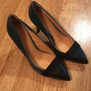 Green faux snakeskin pumps with black details